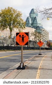 Ottawa, Canada - October 14, 2021: Traffic Control Person Ahead Sign Due To Construction Work In Downtown Of The City. Orange Warning Road Sign Near The National Gallery