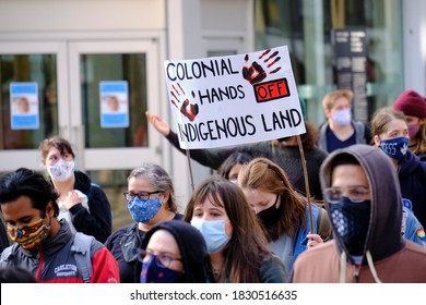 Ottawa, Canada.  October 9th, 2020. First Nation Community Hold An Indigenous Day Of Rage Against Colonialism March Through Streets. Colonial Hands Off Indigenous Land Sign During March