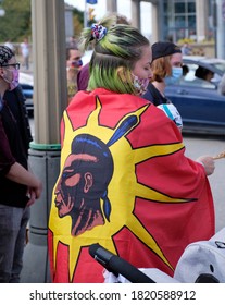 Ottawa, Canada.  September 23, 2020.  Protester Wrapped In Warriors Native Flag At First Nations Groups Ceremonial Songs And Hold Space To Bring To Protest Injustice From The Canadian Government