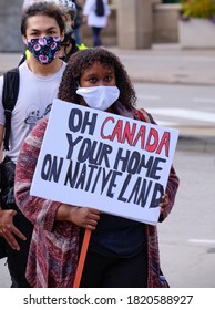 Ottawa, Canada.  September 23, 2020.  Protester At  First Nations Groups Ceremonial Songs And Hold Space With Placard Using National Anthem To Point The Land Steal By White Man