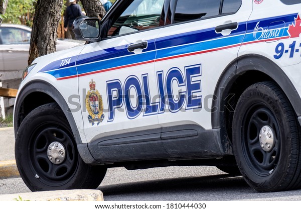 Ottawa, Canada,\
September 6, 2020; Closeup of the door logo of an Ottawa city\
police cruiser in downtown\
Ottawa