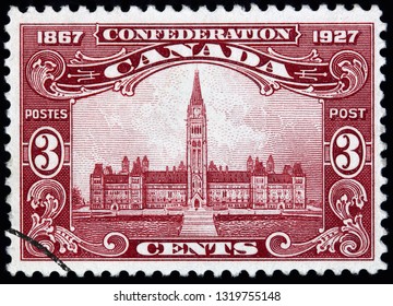 OTTAWA - CIRCA 1927:  An Intricately Engraved Picture Of The Canadian Federal Government Parliament Building On A Stamp To Commemorate Confederation.