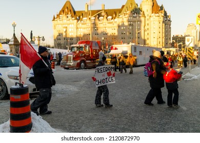 Ottawa - February 5, 2022: Freedom Convoy Protest Attendees Walk On Wellington Street Near Parliament Hill, With The Château Laurier In The Background.