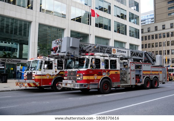 Ottawa Fire Service\
trucks responding to a fire in downtown office tower.  Ottawa,\
Canada, September 3,\
2020