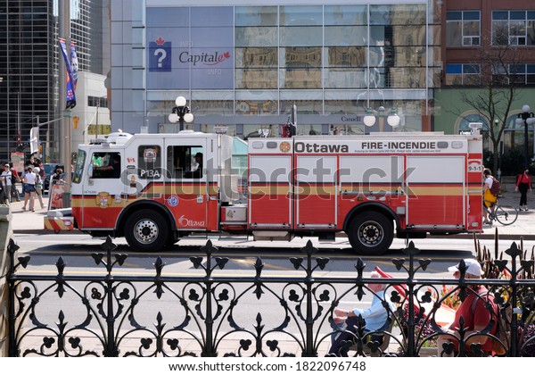 Ottawa Fire\
Service trucks through downtown core, in front of Tourism office.\
Ottawa, Canada.  September 23,\
2020.
