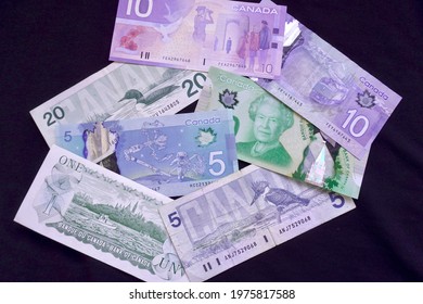 Ottawa, Ontario, Canada - 2021: Canadian Currency Through The Ages. $1, $5, $10 And $20 CAD. Scenes Of Canada, Birds Of Canada, Canadian Journey And Frontier Series Of Banknotes Of Canadian Dollar.