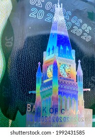 Ottawa, Ontario, Canada - 2021: The Green $20 (twenty Dollar) Polymer Bill From The 2011 Frontier Series Of Canadian Currency. Hologram Image  Of Peace Tower Of Parliament Hill Building.