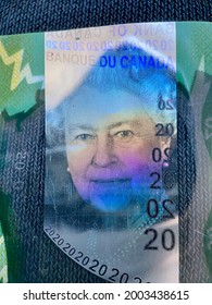 Ottawa, Ontario, Canada - 2021: The Green $20 (twenty Dollar) Polymer Bill From The 2011 Frontier Series Of Canadian Currency. Hologram Image Portrait Of Queen Elizabeth II,  Queen Of Canada.