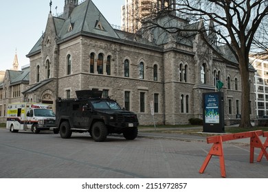 Ottawa, Ontario, Canada - April 29, 2022: A Lenco BearCat Armored Vehicle Operated By The Ottawa Police Service On Standby With An Ambulance During Rolling Thunder Protests Against COVID-19 Mandates.