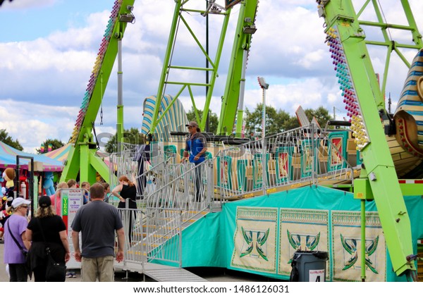 ottawa ontario canada august 23/2019 Capital\
fair exhibition rides, games, prizes. food, fun, bumper cars,\
roller coaster, ferris wheel, merry go\
round.