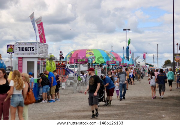 ottawa ontario canada august 23/2019 Capital\
fair exhibition rides, games, prizes. food, fun, bumper cars,\
roller coaster, ferris wheel, merry go\
round.