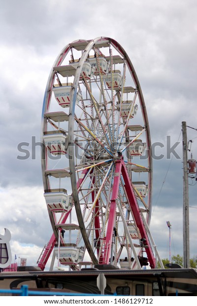 ottawa ontario canada august 23/2019 Capital\
fair exhibition rides, games, prizes. food, fun, bumper cars,\
roller coaster, ferris wheel, pirate\
ship.