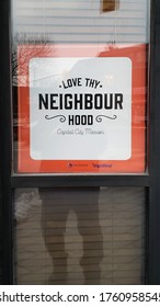 Ottawa Ontario Canada / December 23 2019: A Inspirational Sign I Photographed Walking By The Capital City Mission Window Reading Love Thy Neighbor Hood.