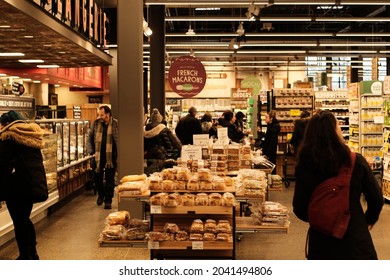 Ottawa, Ontario, Canada - December 31, 2019: Shoppers perusing the bakery section in the local Whole Foods Market at Lansdowne.