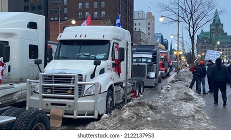 Ottawa Ontario Canada February 11 2022. Freedom Convoy 2022 truckers line up protesting against government's COVID-19 vaccine mandate and other restrictions.
