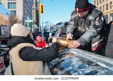 Ottawa, Ontario, Canada - February 5, 2022: Trucker Signing Traditional Indigenous Drum