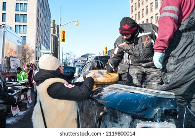 Ottawa, Ontario, Canada - February 5, 2022: Trucker Signing Traditional Indigenous Drum