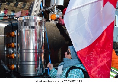 Ottawa, Ontario, Canada - February 5, 2022: Happy Woman Pulling Truck Horn To Honk