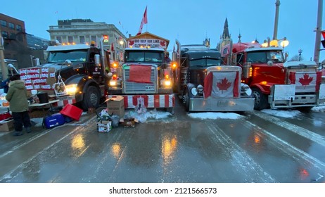 Ottawa Ontario Canada February 5 2022. Freedom Convoy 2022 truck lineup and signage protesting against government's COVID-19 vaccine mandate and other restrictions.