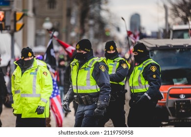 Ottawa, Ontario, Canada - January 30 2022. Police in Ottawa Convoy for Freedom 2022 and Protesters in the Streets.