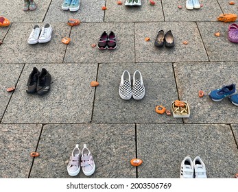 Ottawa Ontario Canada July 1 2021. Canada Day Canadian Parliament Hill. Empty shoes and painted rocks display remembering and honouring indigenous peoples residential school victims.