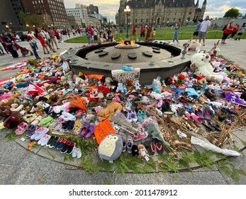Ottawa Ontario Canada July 1 2021. Canada Day Canadian Parliament Hill crowd and remembrance display honoring indigenous peoples residential school victims.