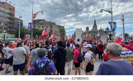 Ottawa Ontario Canada July 1 2022. Canada Day Crowd And Flags In Front Of Parliament Hill On Wellington Street.