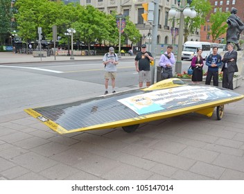 OTTAWA, ONTARIO, CANADA - MAY 31: Solar Car Project XOF1 in front of the Parliament Buildings during the  Environment - Inspirational Walk 2012 from Toronto to Ottawa Ontario, Canada May 31, 2012