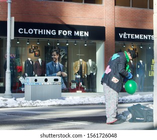 Ottawa Ontario Canada November 16/2019 Man With Black Hat, Green Scarf, Colourful Clothes Making Balloons, Busker, Elf Costume, Christmas Holiday, Street Entertainer