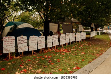 OTTAWA, ONTARIO, CANADA - OCTOBER 8, 2020: Signs Accusing The Canadian Federal Government Of Misdeeds, Most Fueled By Conspiracy Theories Found Online, Surround Tents In Ottawa's Confederation Square.