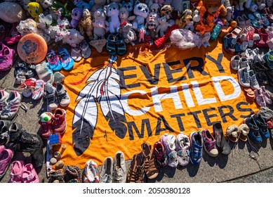 OTTAWA, ONTARIO, CANADA - SEP.T. 30, 2021: An Every Child Matters Banner Is Surrounded By Children's Shoes And Toys.  They Represent First Nations Children Who Died In Residential Schools.