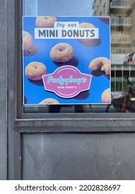 Ottawa Ontario Canada September 10 2022. Pudgyboy's Mini Donuts Advertising Sign In Their Storefront Window.