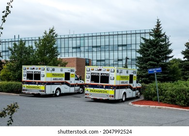 OTTAWA, ONTARIO, CANADA - SEPTEMBER 2, 2021: Two ambulances are parked outside of the emergency department of the Queensway-Carleton Hospital in Ottawa.