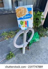 Ottawa Ontario Canada September 2 2022. Life Cereal Empty Box Placed Up Side Down On A Bicycle Rack Station Located On Bank Street.