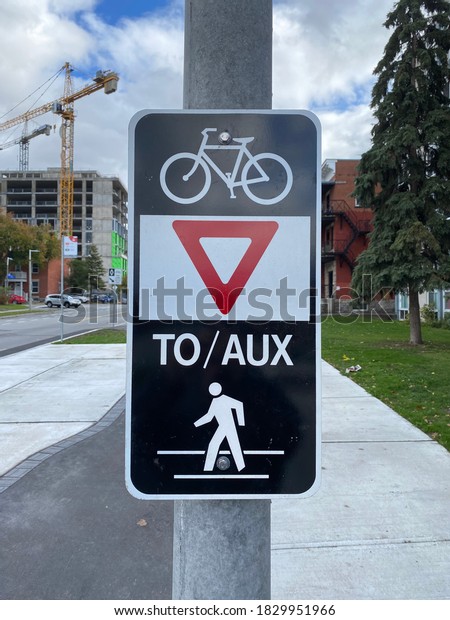 Ottawa Ontario Canada / September 7 2020. Cobourg\
street directional bicycle and walking signage. Located in\
Lowertown East.