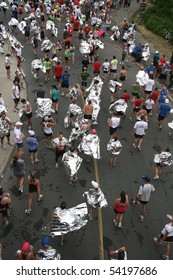 OTTAWA, ONTARIO - MAY 30: Marathon Runners Wrap Themselves In Foil Blankets After Completing The Ottawa Marathon On May 30, 2010 In Ottawa, Ontario, Canada.