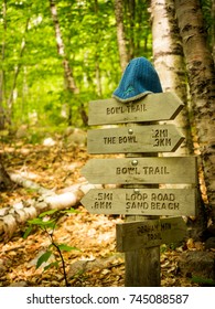 Otter Creek, USA - October 10 2015: Hiking Signs And A Hat At A Trail In Acadia National Park.