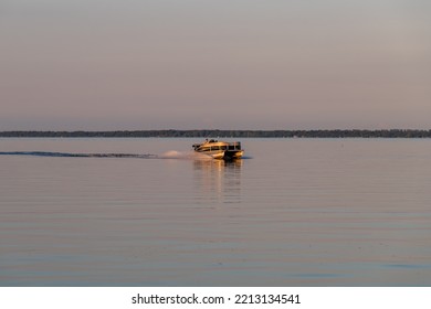 Otter Tail Lake, Minnesota USA July 10, 2022 People On A Pontoon Boat On Otter Tail Lake At Sunset In Rural Minnesota.
