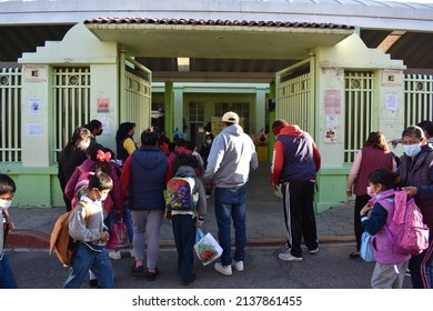 Otumba, State Of Mexico, Mexico - March 10, 2022: Children Lined Up To Enter The Primary School With Sanitary Measures