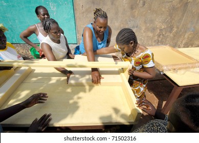 OUAGADOUGOU,BURKINA FASO -  MARCH 4: African Women Produce Shea Butter On March 4, 2005 In Ouagadougou, Burkina Faso. Shea Butter Is Used In Africa For Food And Is Widely Used In Cosmetics As A Moisturizer.