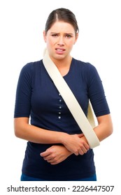 Ouch. Studio Shot Of A Young Woman With Her Arm In A Sling Isolated On White.