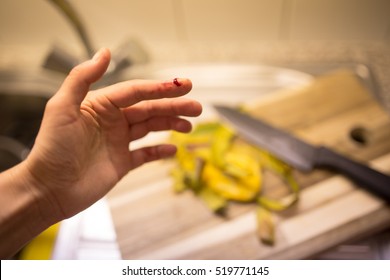 Ouch! Woman Cut Her Finger While Cooking A Dinner In Her Kitchen.