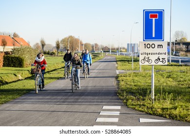 OUD GASTEL - THE NETHERLANDS - NOVEMBER 29: Schoolchildren on the bike on a one-way street