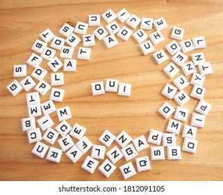 Oui word concept written on a wooden background - Powered by Shutterstock