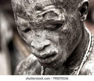 Ouidah, Benin – January 10, 2012: Voodoofestival - Man Is In A Trance Of The Rhythm Of The Drums And Has Oil And White Powder On His Face.