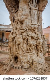 Ouidah, Benin - March 06, 2014: Carved tree trunk in center of town depicting time of slavery