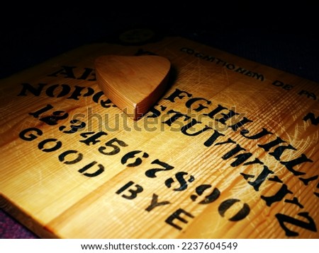 Ouija board paranormal investigation and ghost hunting medium shot selective focus