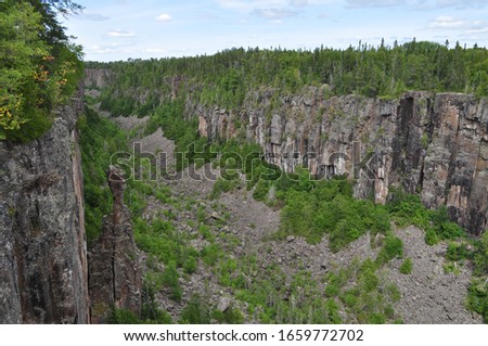 ouimet canyon with totem stone in canada