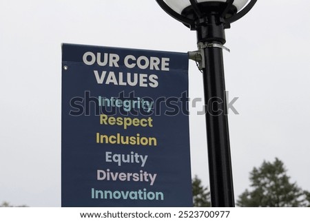 Our Core Values (integrity, respect, inclusion, equity, diversity, innovation) sign hanging off lamp post