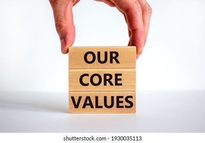 Our core values symbol. Concept words 'Our core values' on wooden blocks on a beautiful white background, businessman hand. Business and our core values concept. Copy space. - Shutterstock ID 1930035113